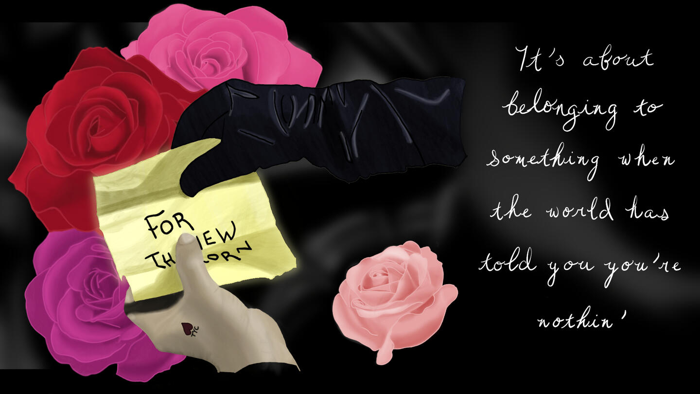 A yellow note is being opened and can be partially read: “FOR TH … EW … ORN”. One hand holding the note is inside a long black leather glove, creased and reflecting light; the other is bare with a small tattoo of a heart and the letters “TYC” beneath the h